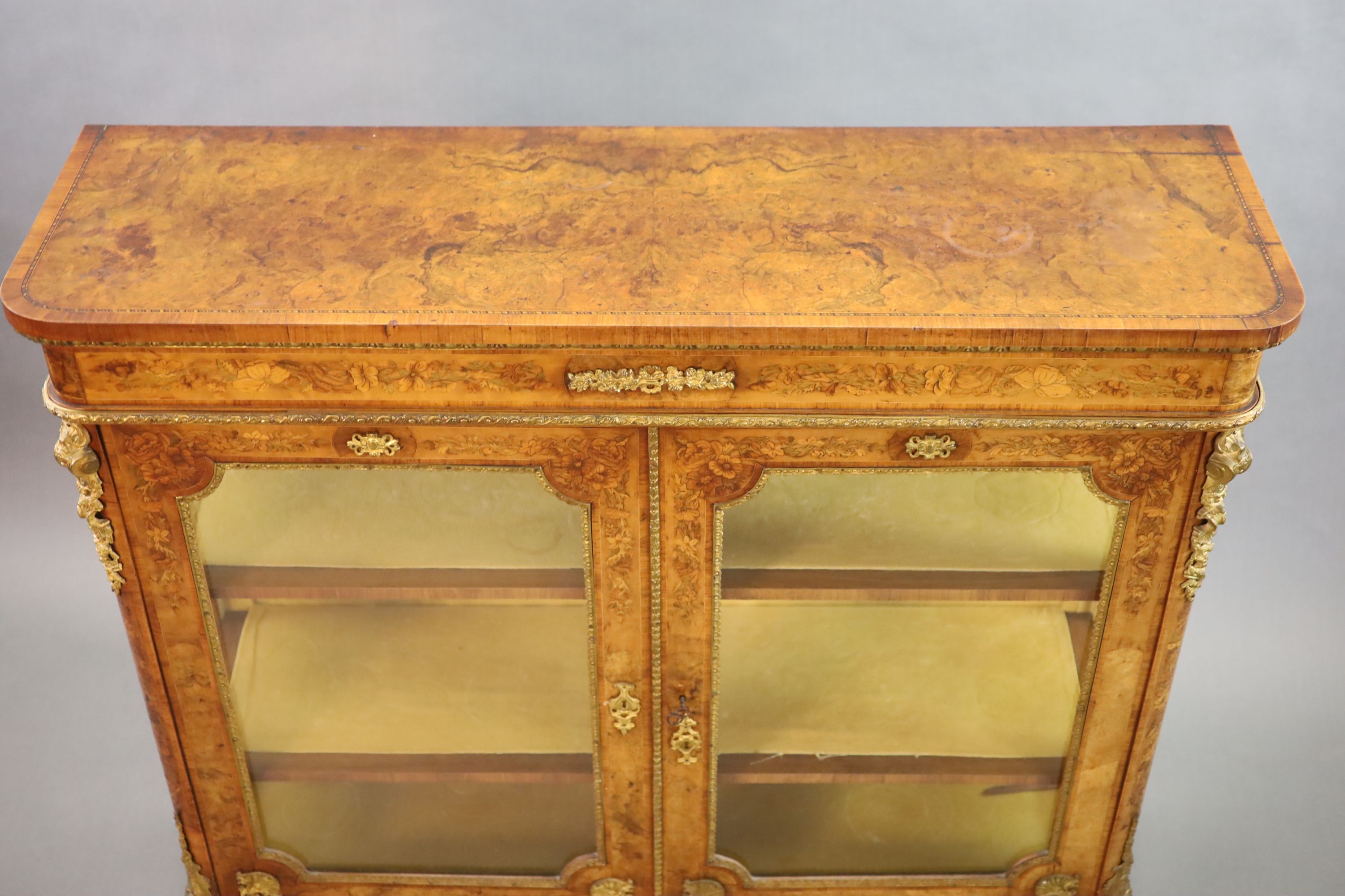 A Victorian ormolu mounted marquetry inlaid walnut bookcase, W.126cm D.38cm H.115cm